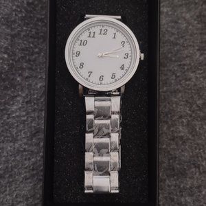 QUARTZ WATCH WITH WHITE FACE AND BOLD NUMBERS.
